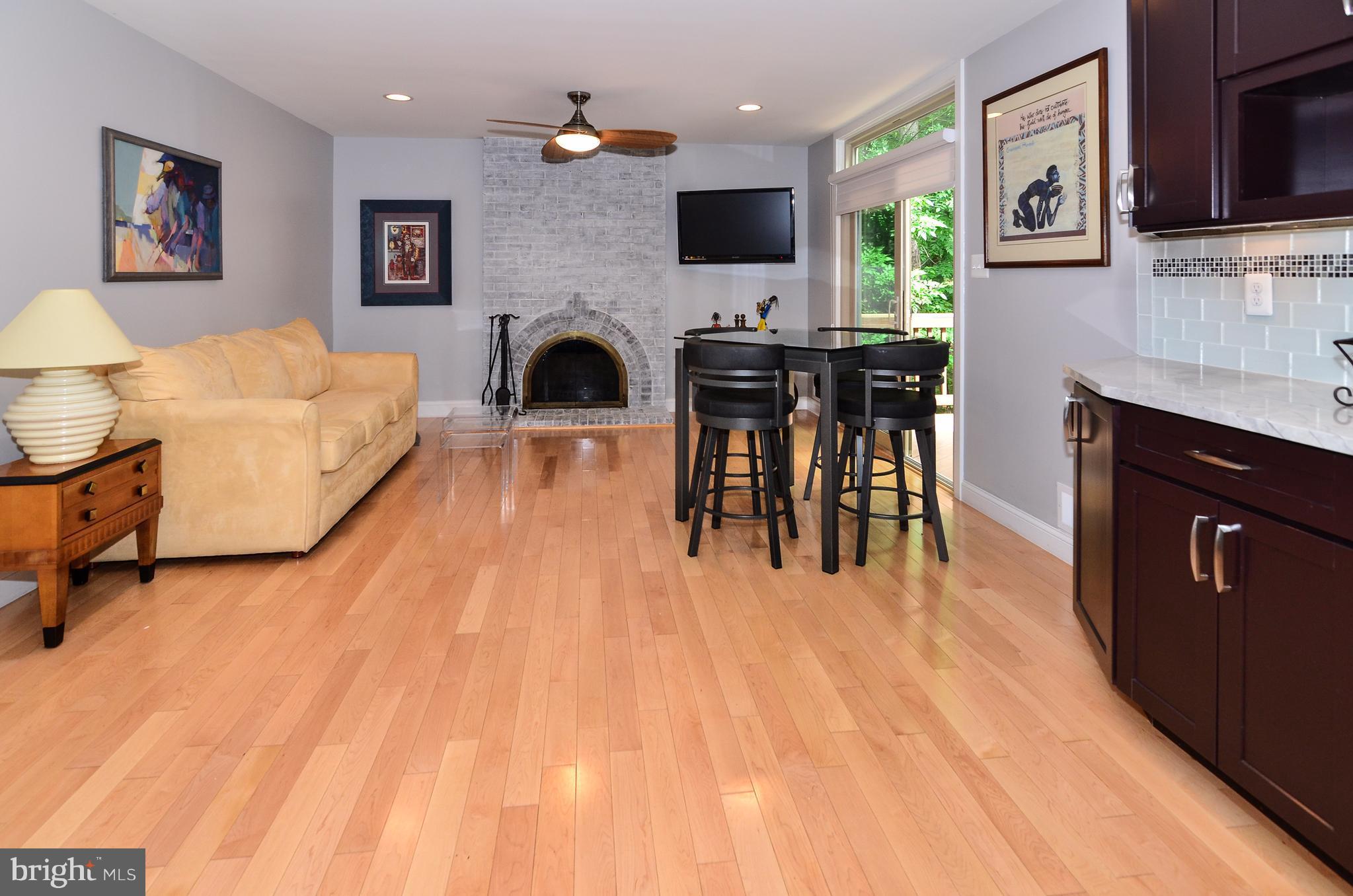10920 Thanlet Lane Reston, VA 20190 - Photo 11 of 30 Kitchen/Sun Room W/Exposed Brick Wood Burning FP.