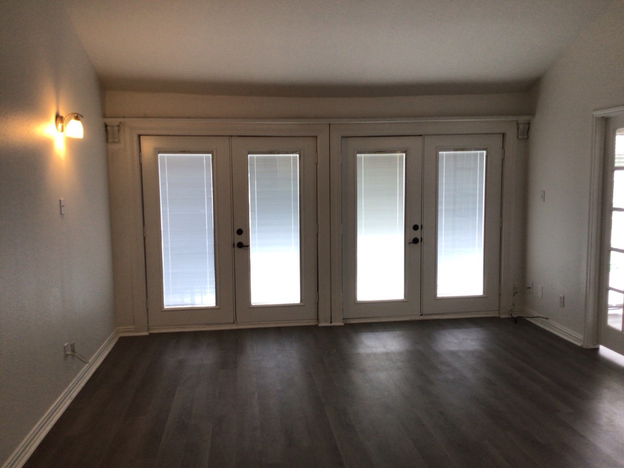176 April Point Drive North Conroe, TX 77356 - Photo 11 of 17 a view of wooden floor and windows in a room
