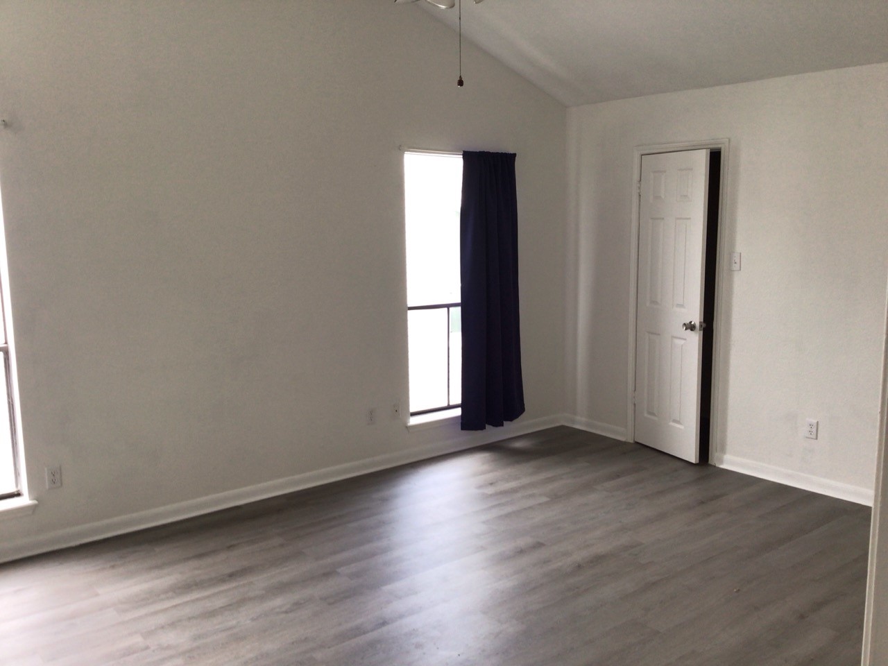 176 April Point Drive North Conroe, TX 77356 - Photo 16 of 17 an empty room with wooden floor and window