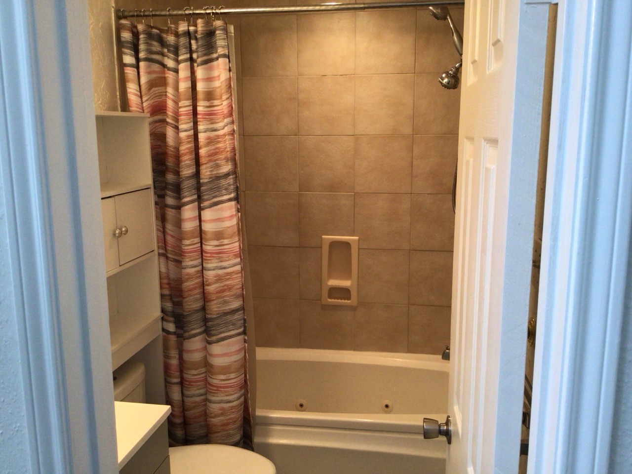 176 April Point Drive North Conroe, TX 77356 - Photo 17 of 17 a bathroom with a bathtub and a shower