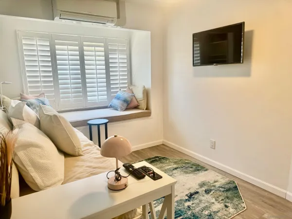 a living room with furniture and a window