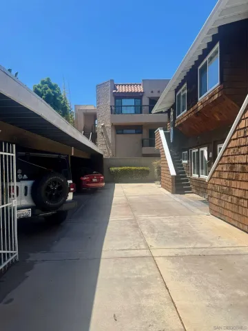 a view of a car park in front of house