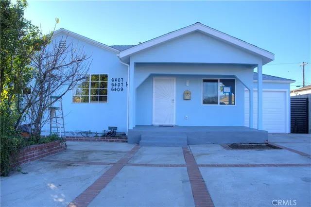 a house with trees in the background