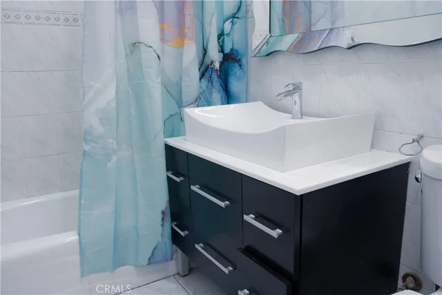 a view of a room that has a window and wooden floor