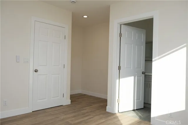 a bathroom with a sink vanity mirror and toilet