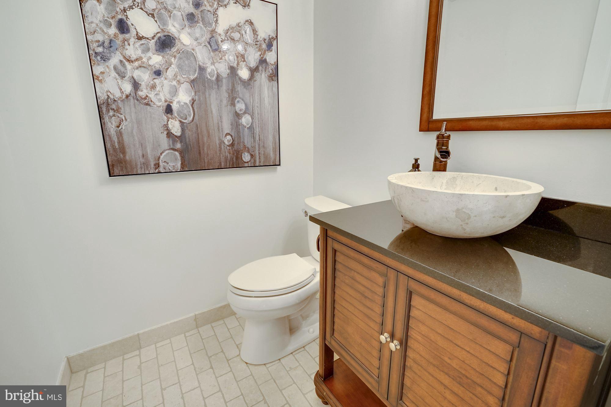 100 Chimney Ridge Place Sterling, VA 20165 - Photo 52 of 69 Half Bathroom w/vessel sink & marble tile flooring