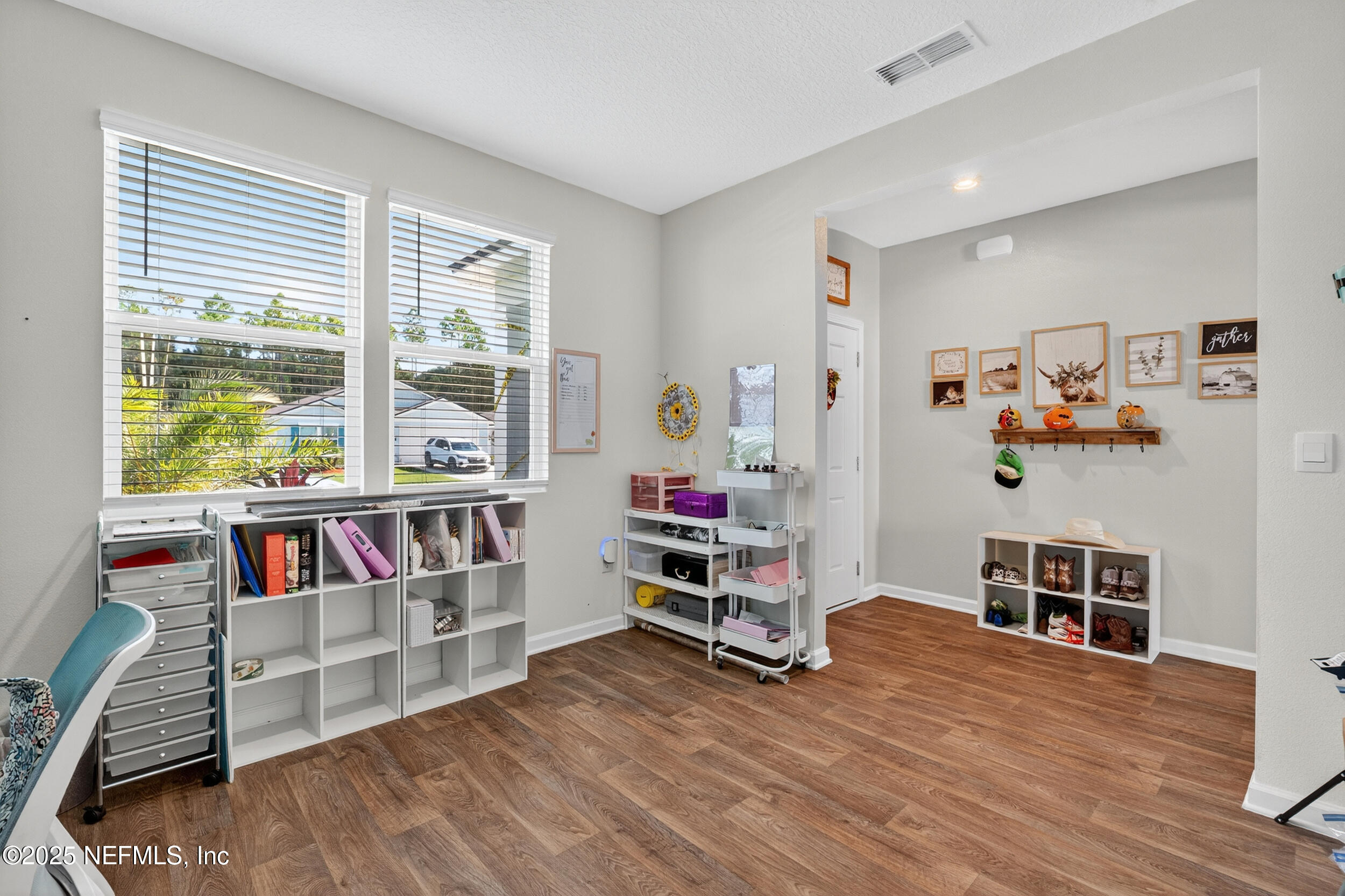 125 Hulett Wds Road Palm Coast, FL 32137 - Photo 16 of 40 a living room with furniture and a wooden floor