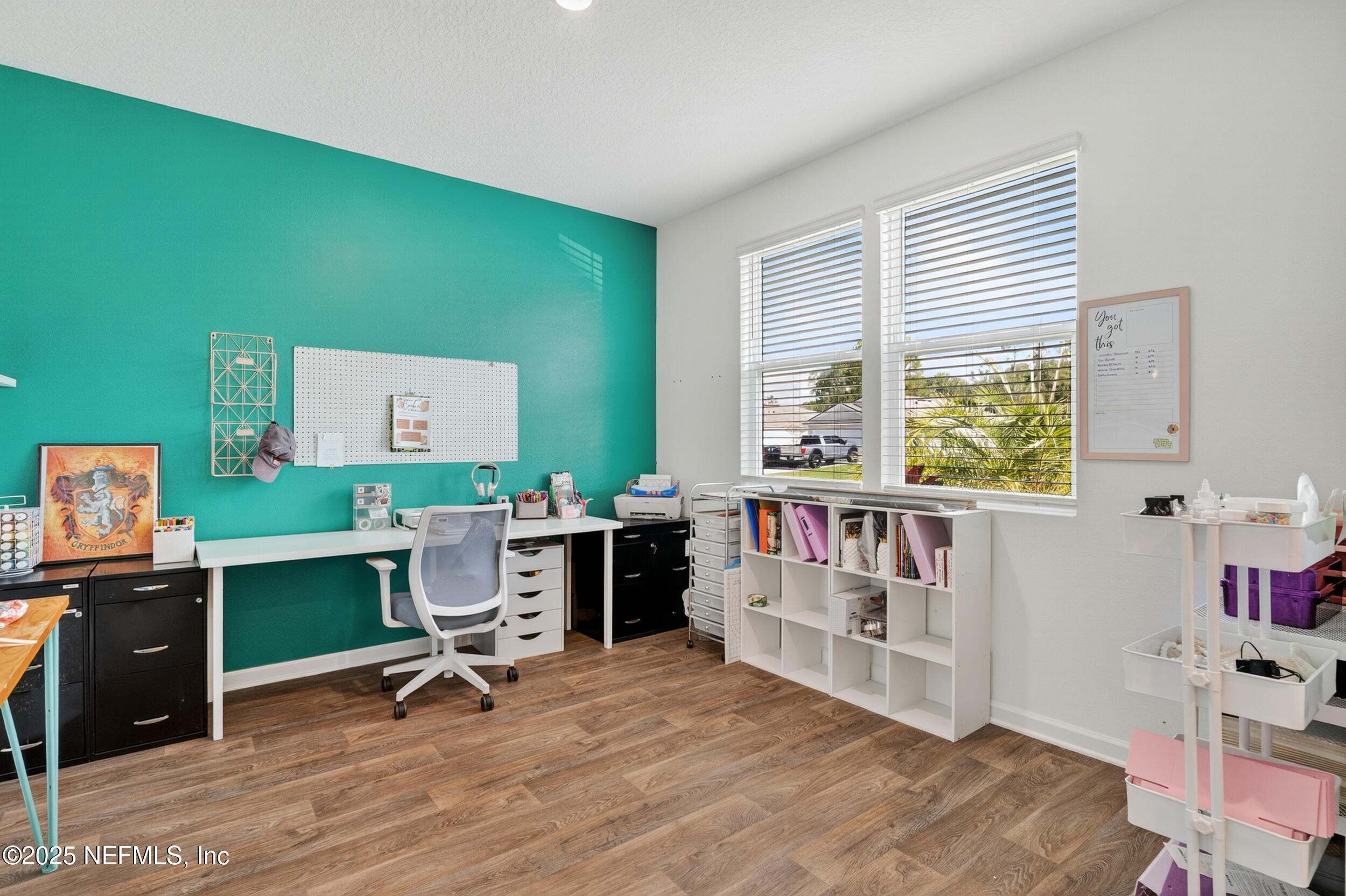 125 Hulett Wds Road Palm Coast, FL 32137 - Photo 17 of 40 a view of a workspace with furniture and a window