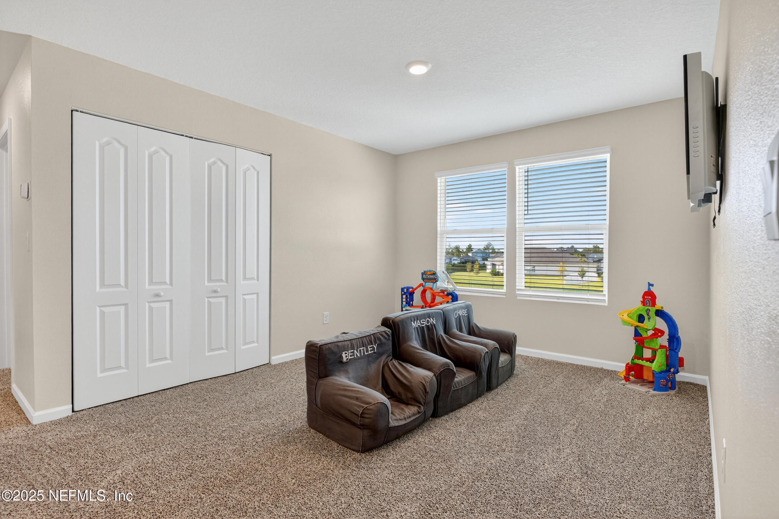 125 Hulett Wds Road Palm Coast, FL 32137 - Photo 21 of 40 a living room with furniture and a window