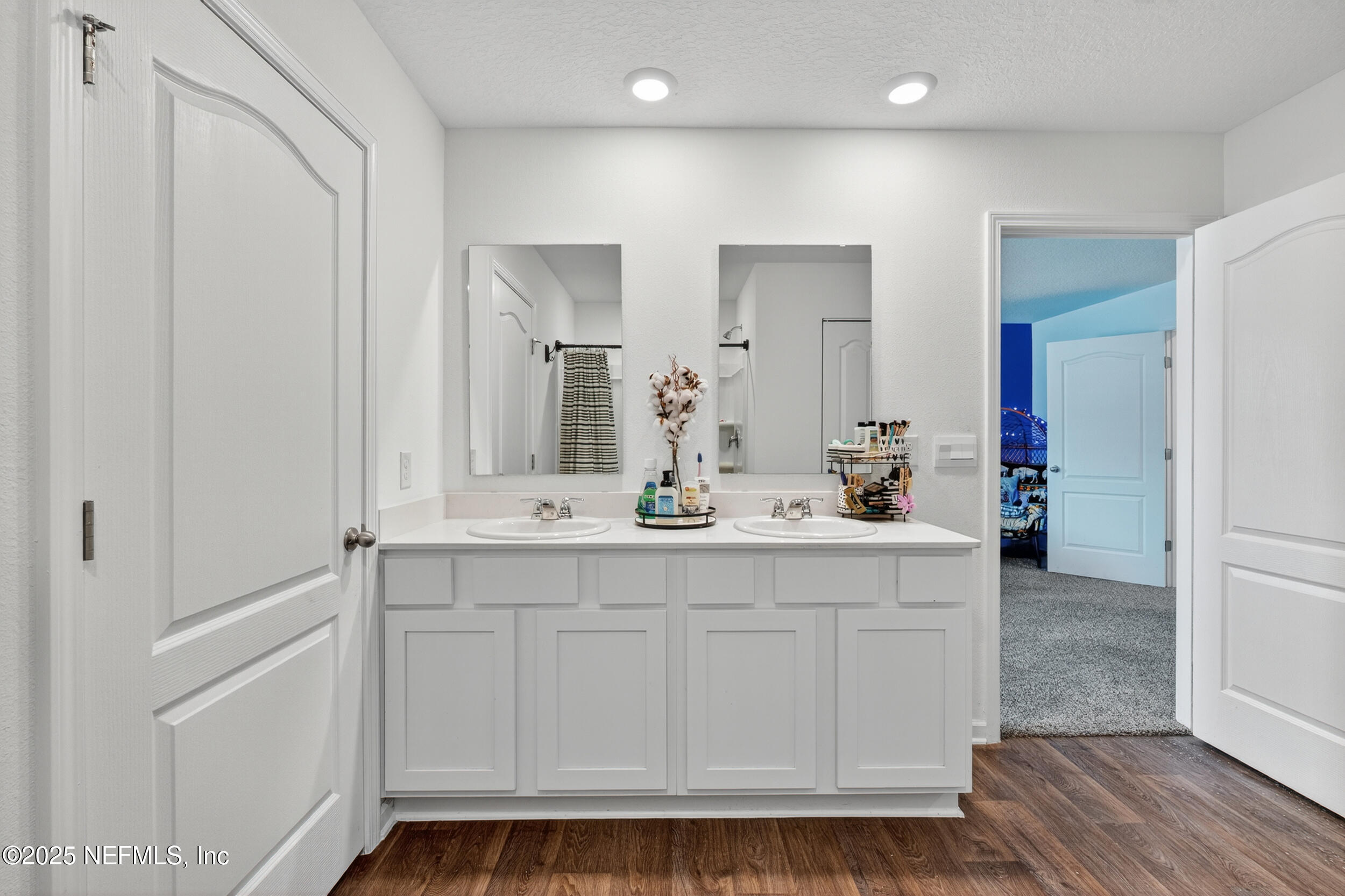 125 Hulett Wds Road Palm Coast, FL 32137 - Photo 24 of 40 a bathroom with a sink and a mirror