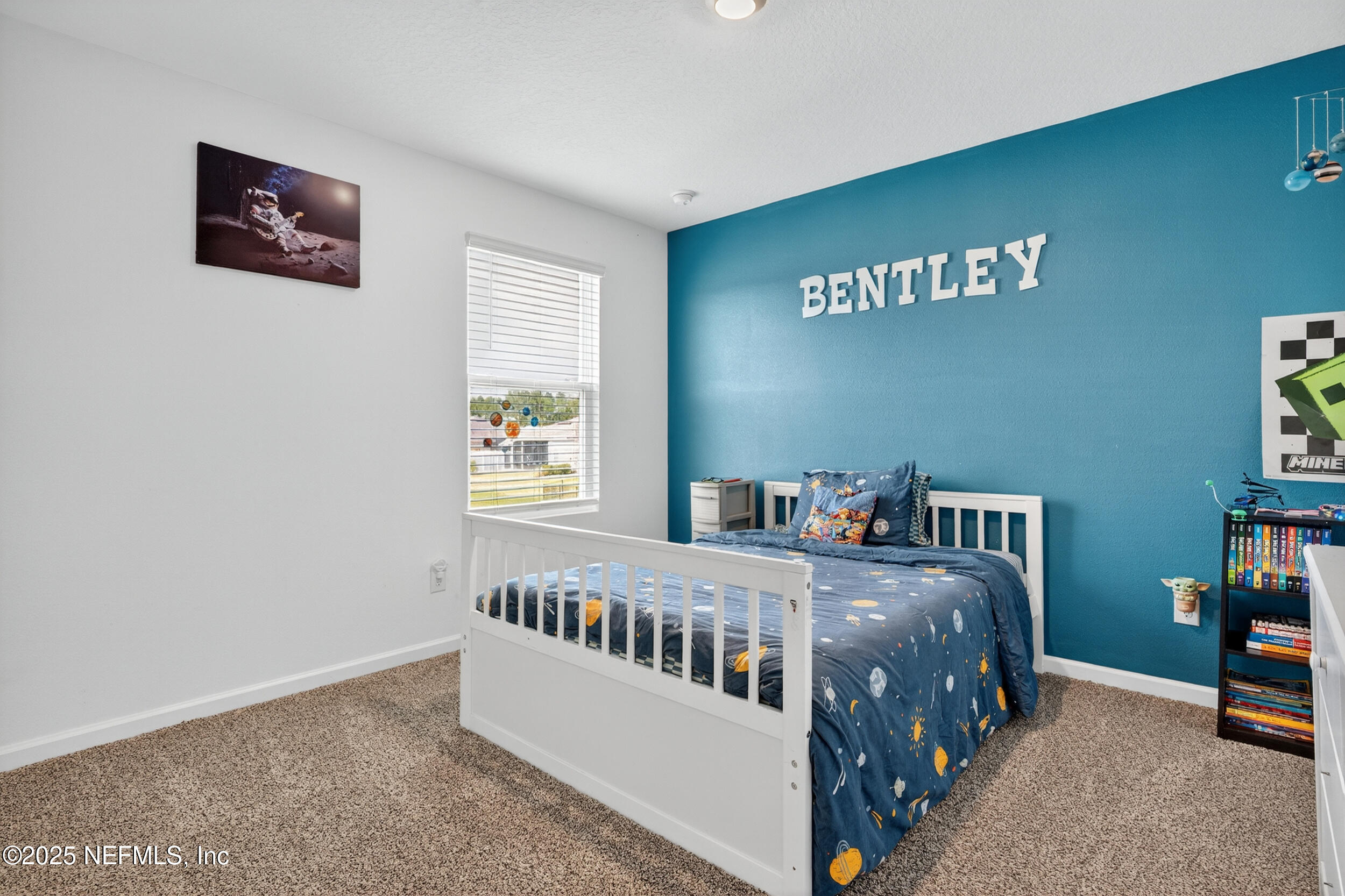 125 Hulett Wds Road Palm Coast, FL 32137 - Photo 27 of 40 a bedroom with a bed and a window