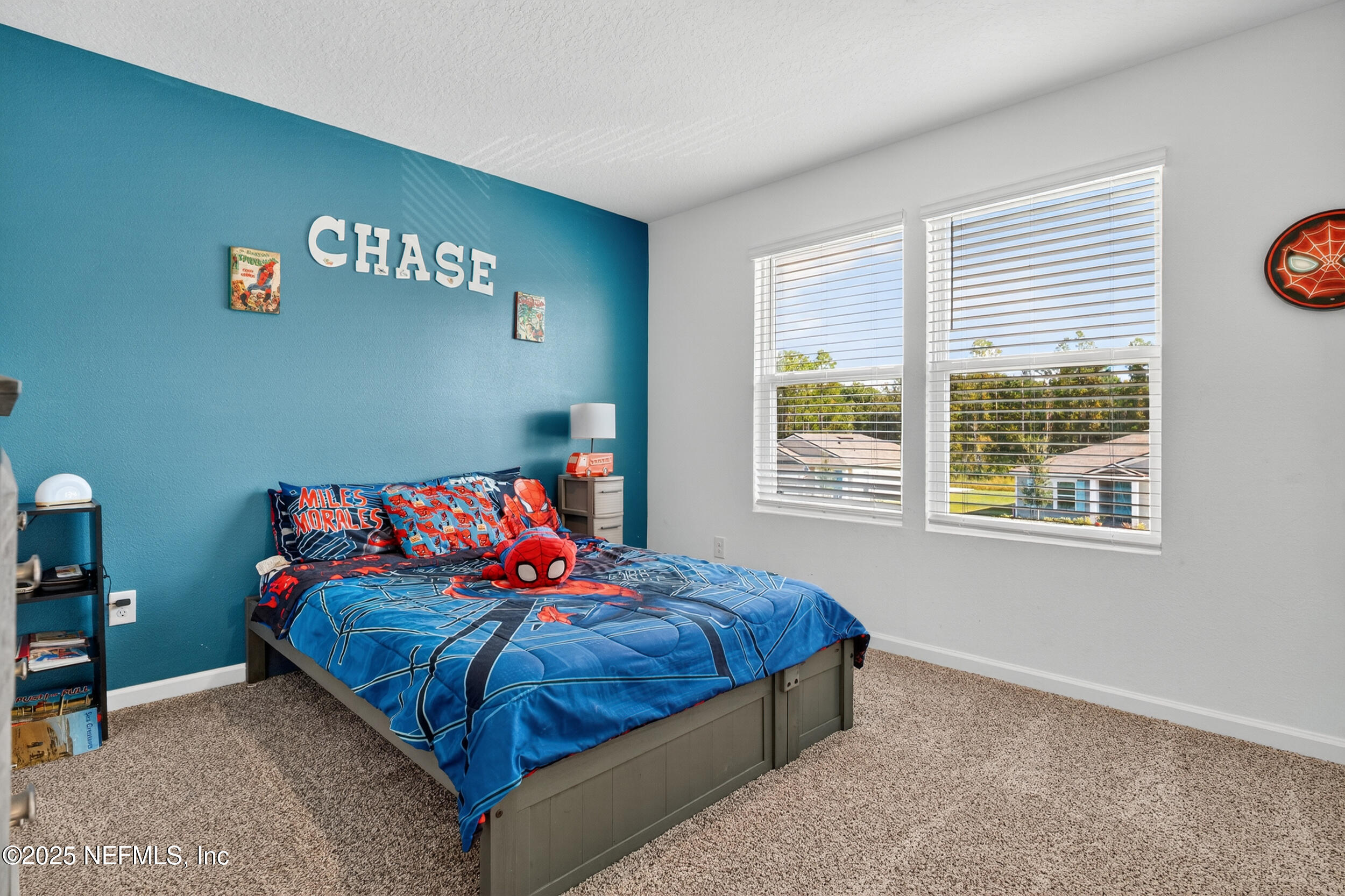 125 Hulett Wds Road Palm Coast, FL 32137 - Photo 29 of 40 a bedroom with a bed and a window