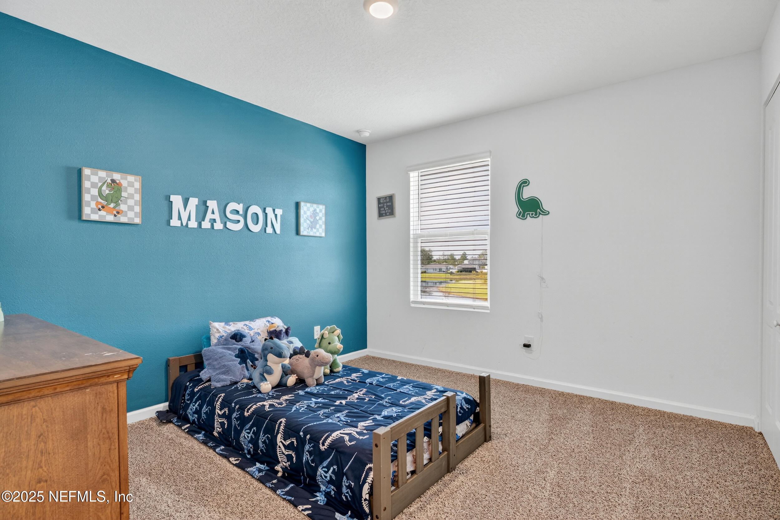 125 Hulett Wds Road Palm Coast, FL 32137 - Photo 30 of 40 a bedroom with a bed and a window