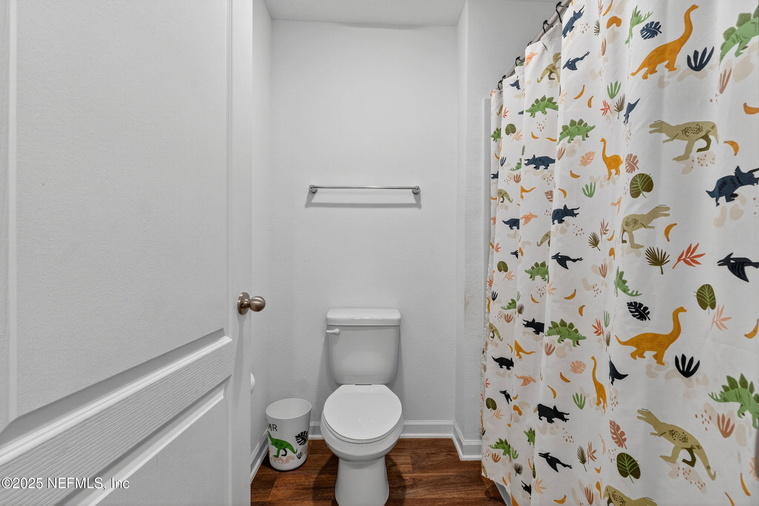 125 Hulett Wds Road Palm Coast, FL 32137 - Photo 33 of 40 a bathroom with a toilet and a shower curtain