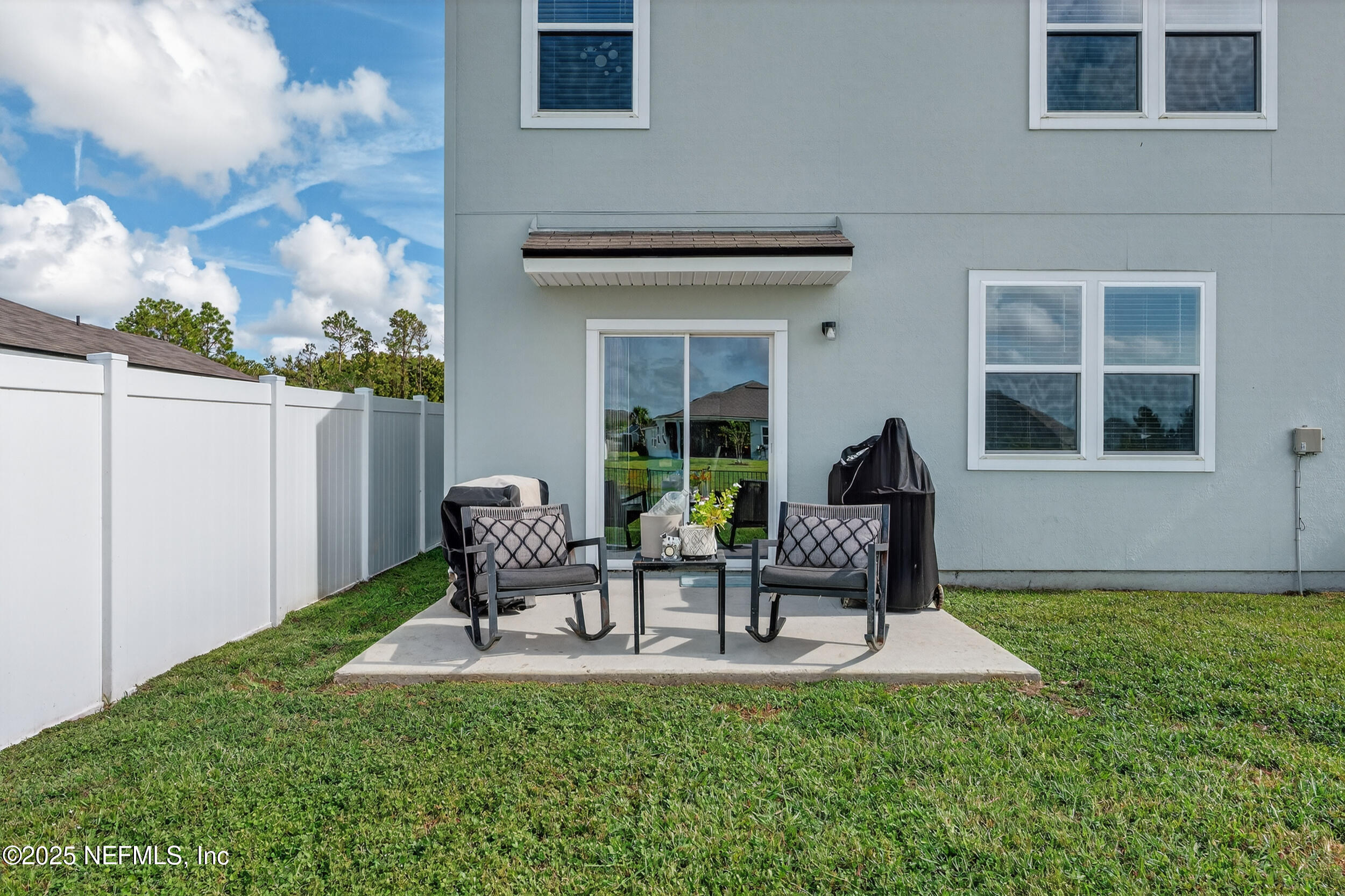 125 Hulett Wds Road Palm Coast, FL 32137 - Photo 35 of 40 a house view with a seating space and garden
