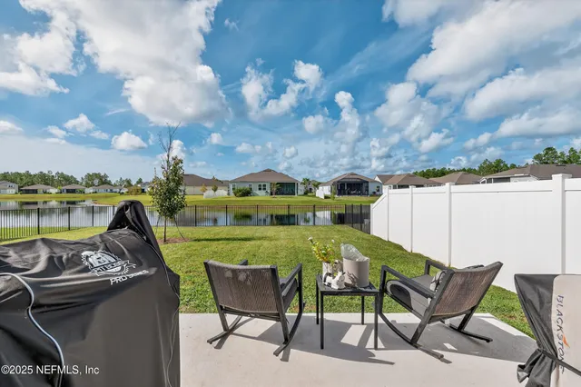 a view of a chairs and table in the terrace
