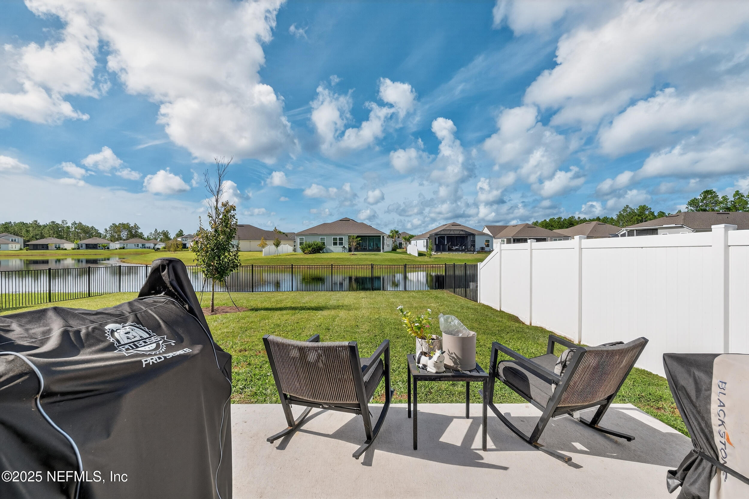 125 Hulett Wds Road Palm Coast, FL 32137 - Photo 37 of 40 a view of a chairs and table in the terrace