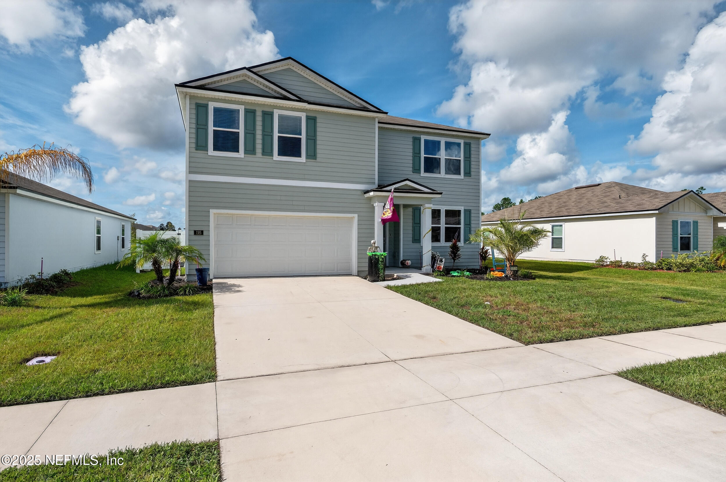 125 Hulett Wds Road Palm Coast, FL 32137 - Photo 38 of 40 a front view of a house with a yard