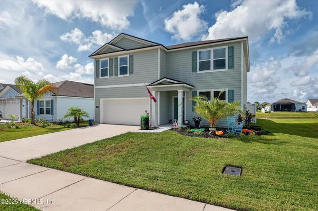 a front view of a house with a yard