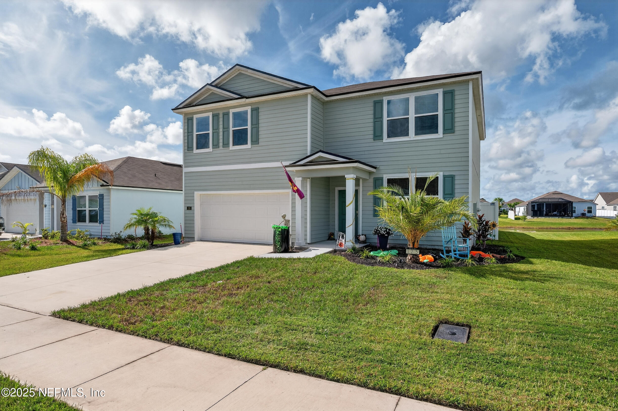 125 Hulett Wds Road Palm Coast, FL 32137 - Photo 39 of 40 a front view of a house with a yard