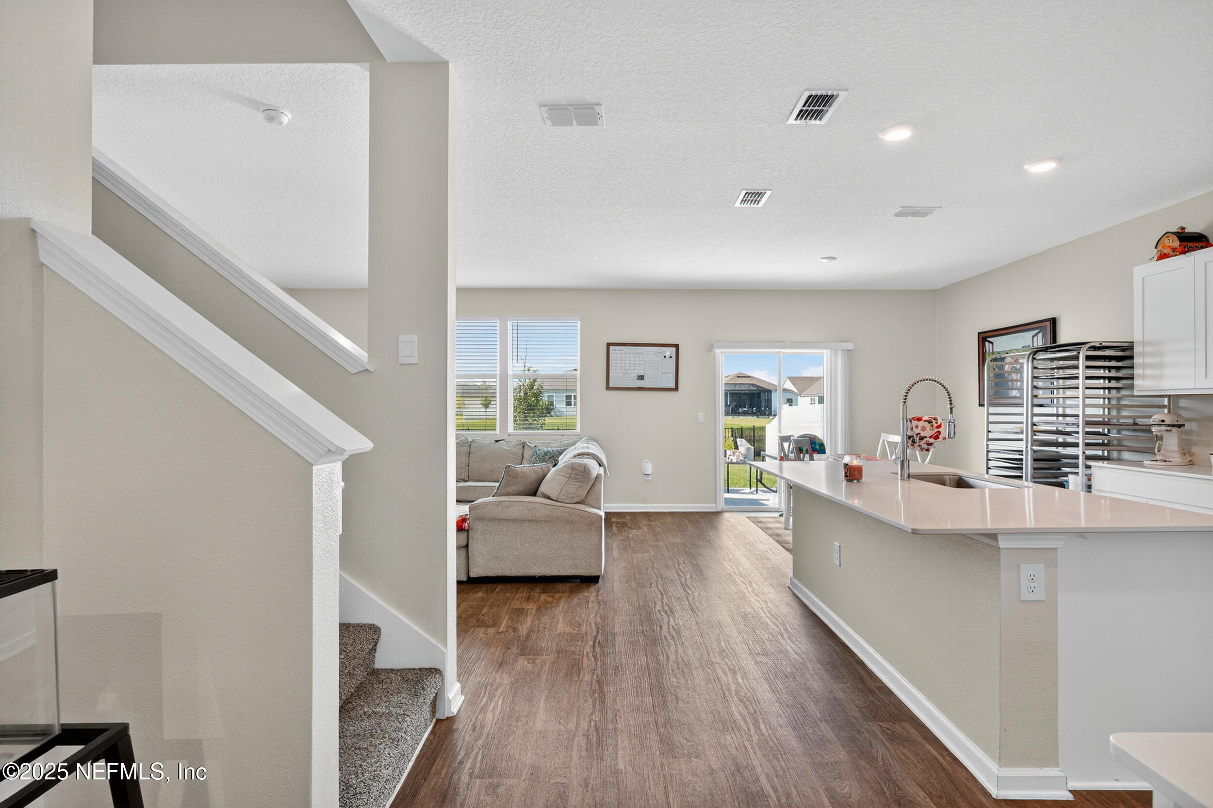 125 Hulett Wds Road Palm Coast, FL 32137 - Photo 6 of 40 a living room with furniture and a wooden floor
