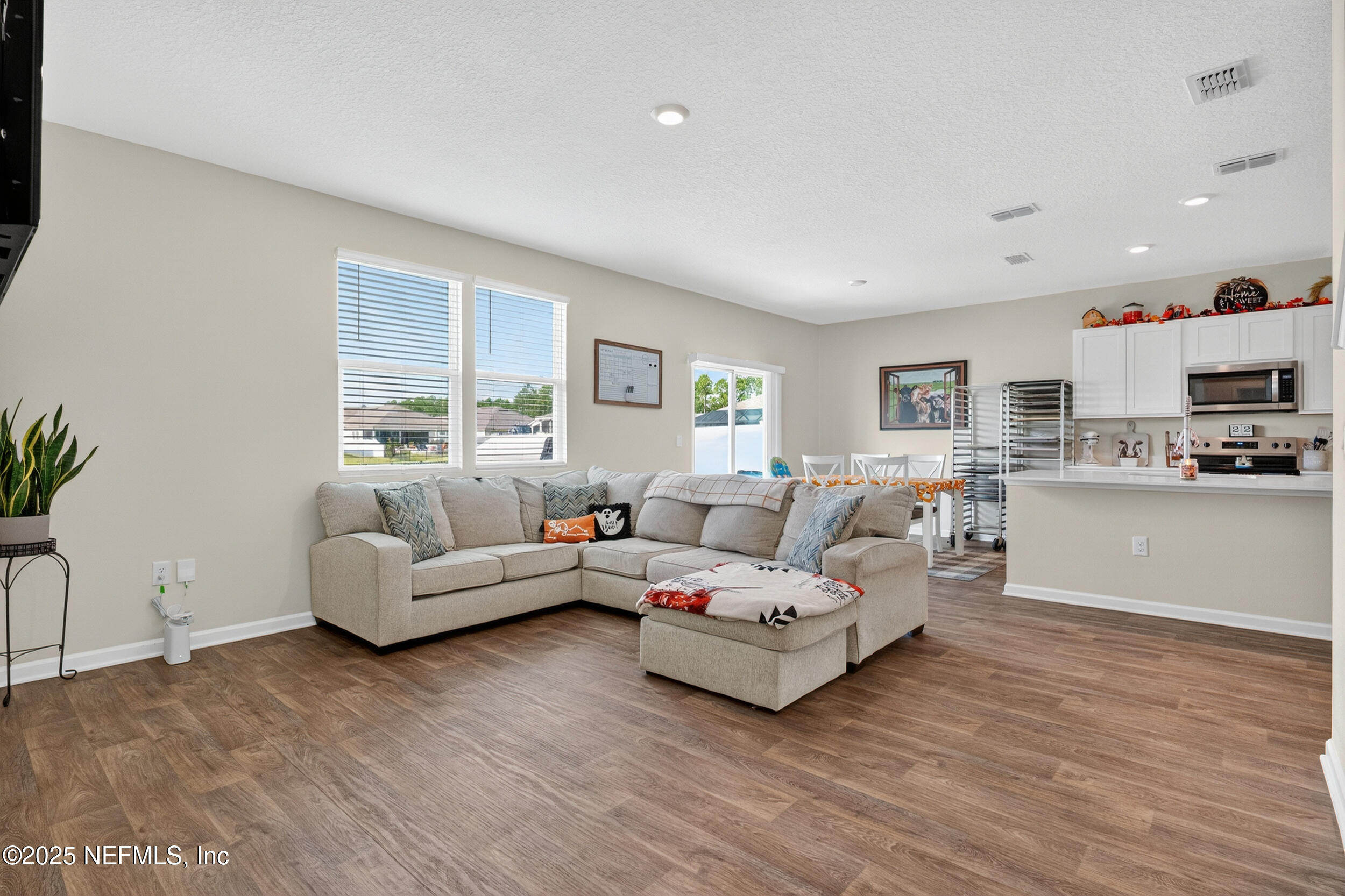 125 Hulett Wds Road Palm Coast, FL 32137 - Photo 7 of 40 a living room with furniture and a large window