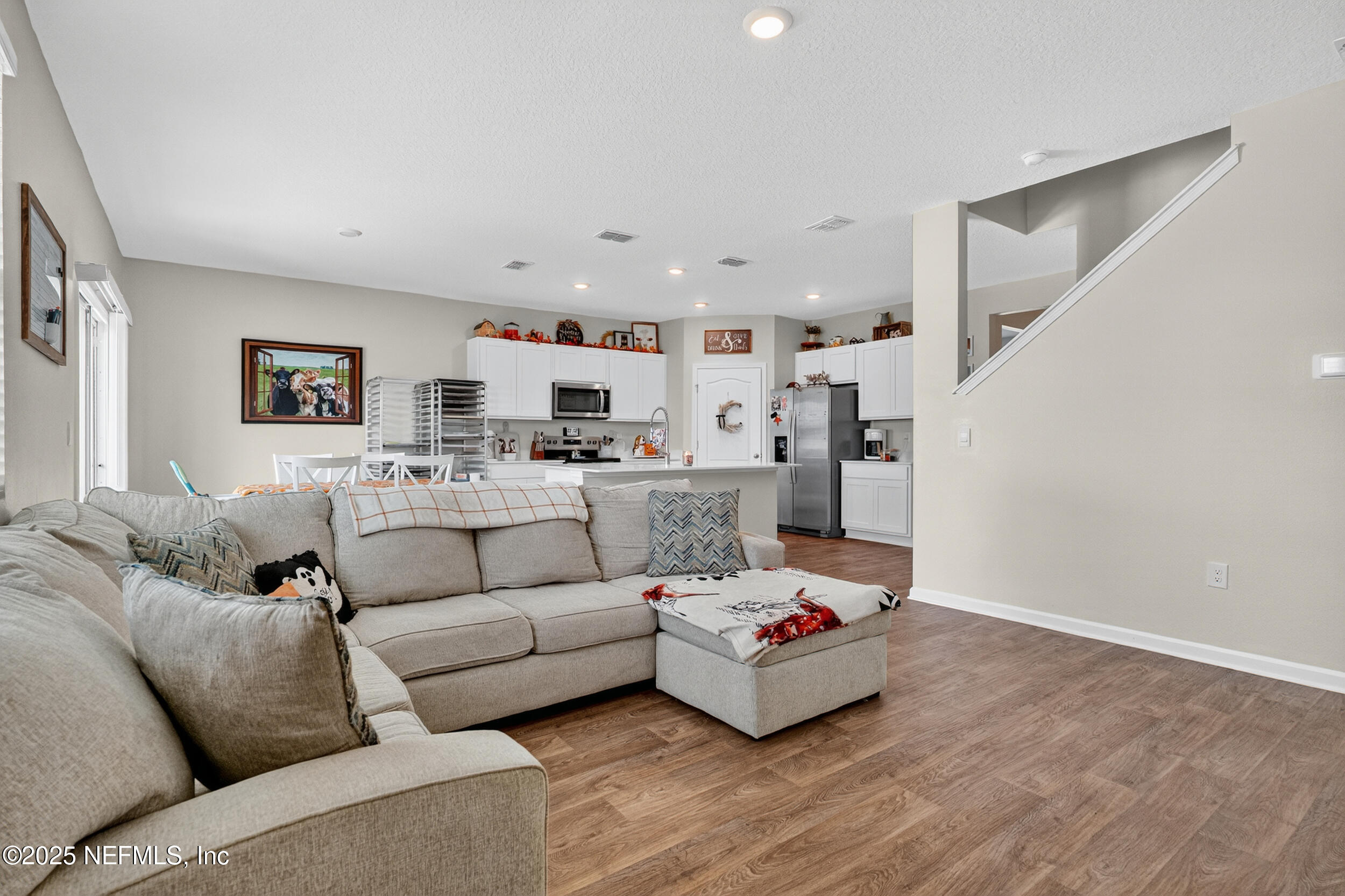 125 Hulett Wds Road Palm Coast, FL 32137 - Photo 9 of 40 a living room with furniture and kitchen view