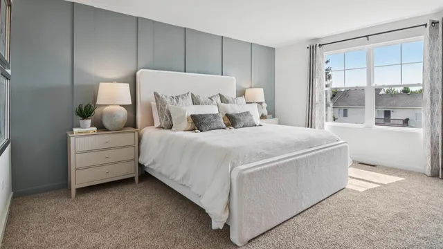 a bedroom with bed and window