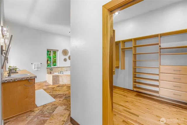 a bathroom with a sink double vanity and a mirror