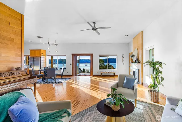a dining room with furniture water view and a kitchen island