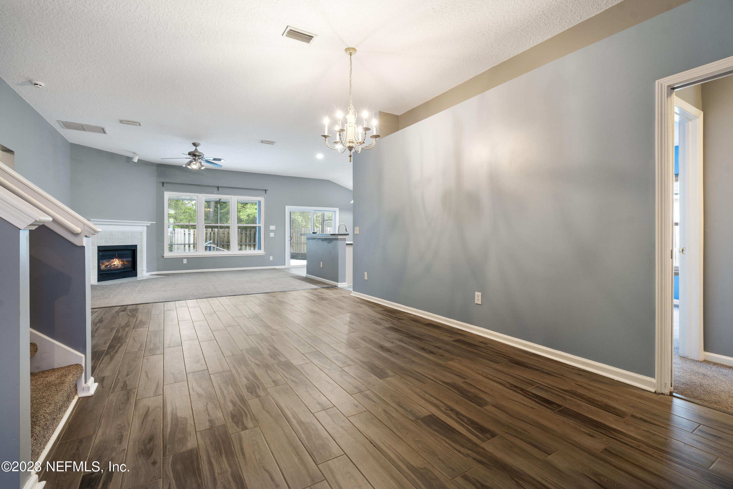 312 West Tropical Trace St. Johns, FL 32259 - Photo 13 of 57 an empty room with wooden floor and windows