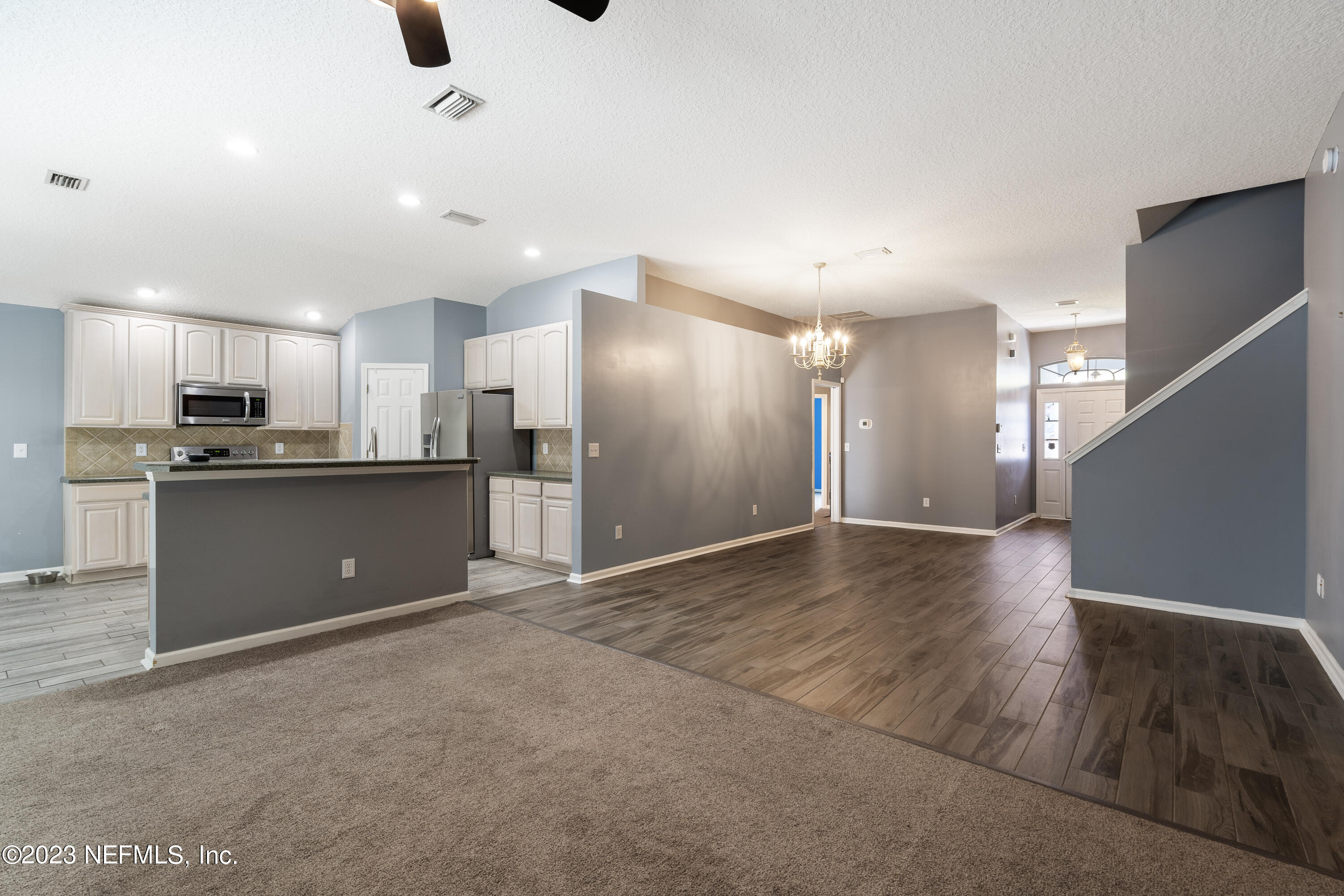 312 West Tropical Trace St. Johns, FL 32259 - Photo 15 of 57 a view of kitchen with refrigerator and microwave