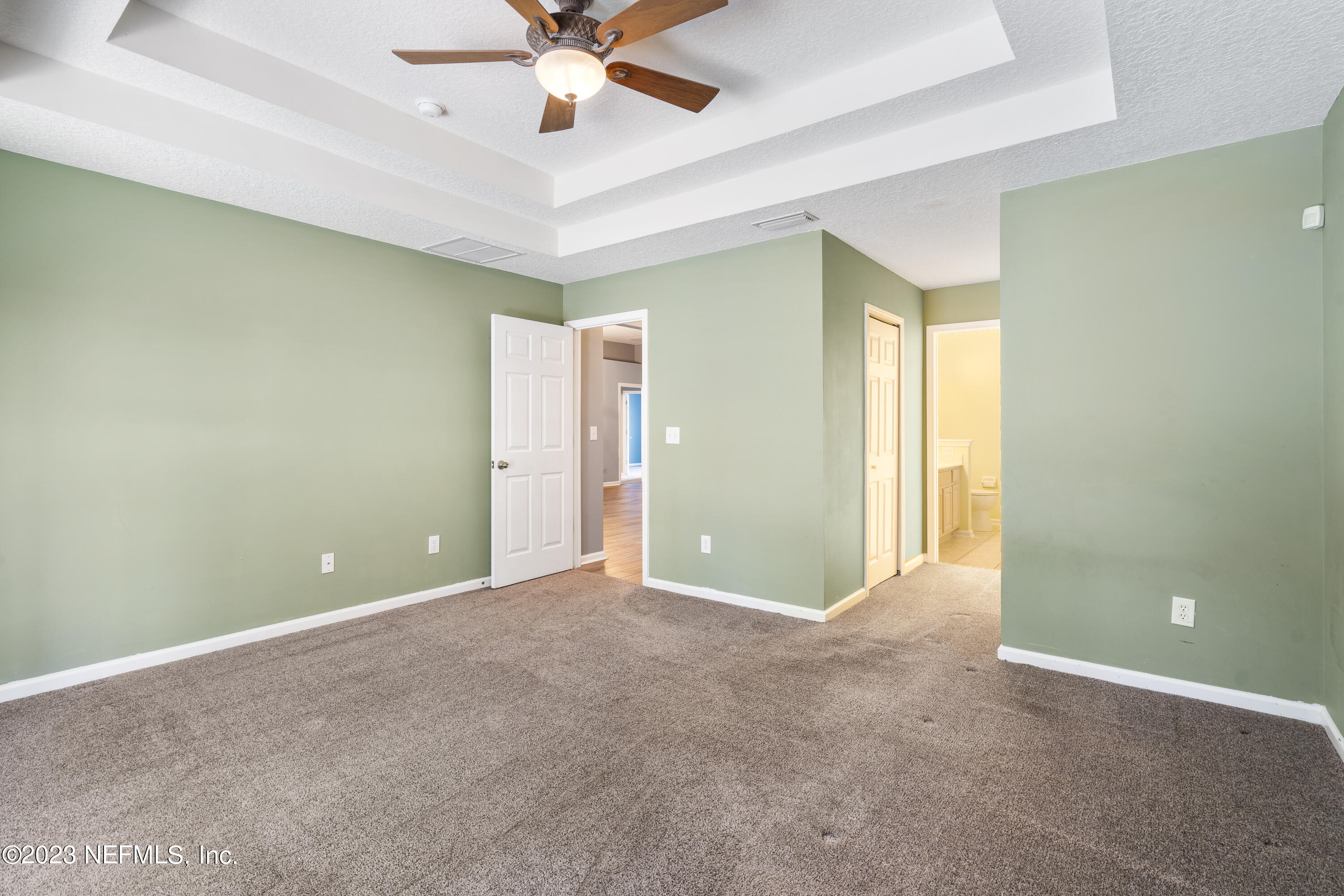 312 West Tropical Trace St. Johns, FL 32259 - Photo 23 of 57 a view of an empty room with a chandelier fan