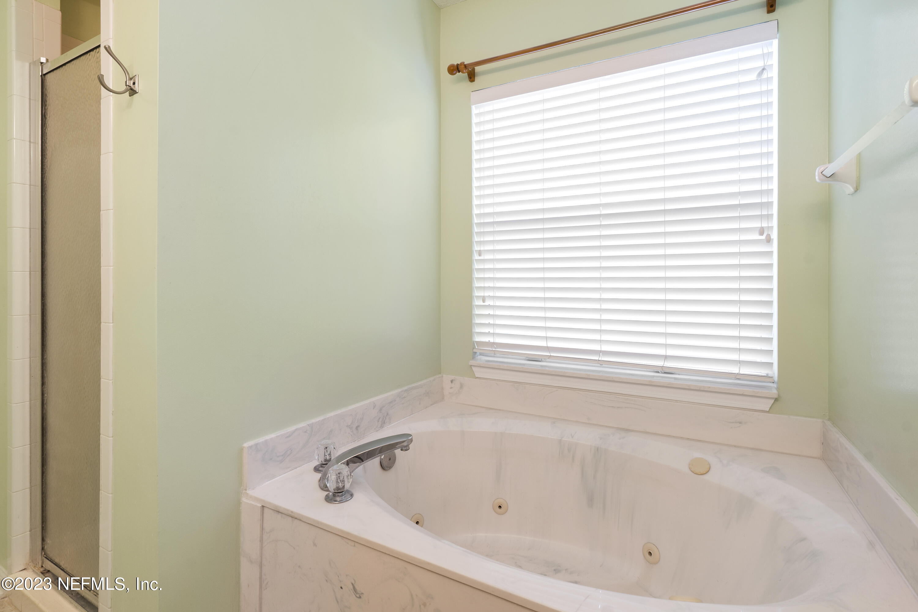 312 West Tropical Trace St. Johns, FL 32259 - Photo 25 of 57 a white bath tub sitting next to a window
