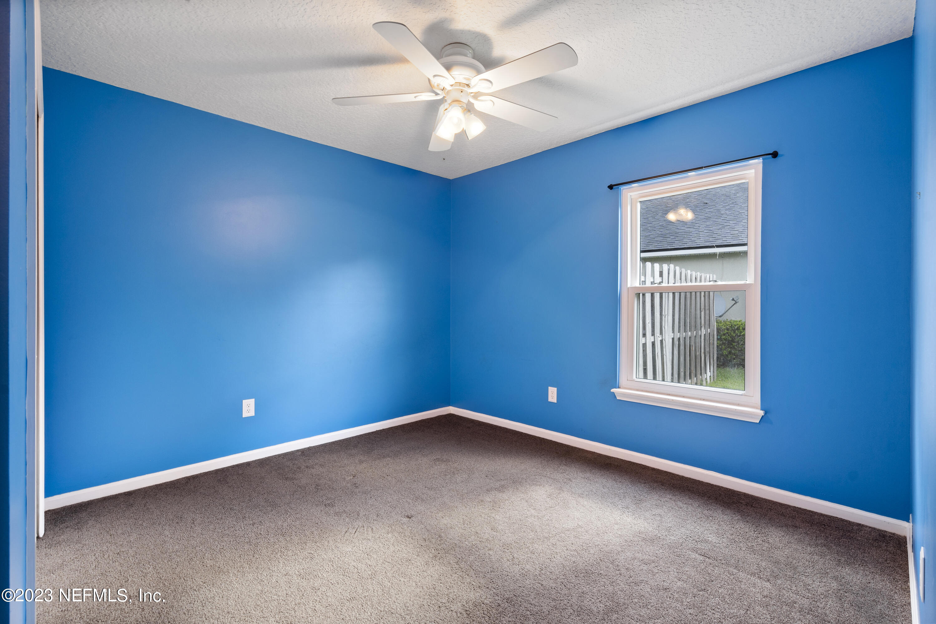 312 West Tropical Trace St. Johns, FL 32259 - Photo 29 of 57 an empty room with windows and fan