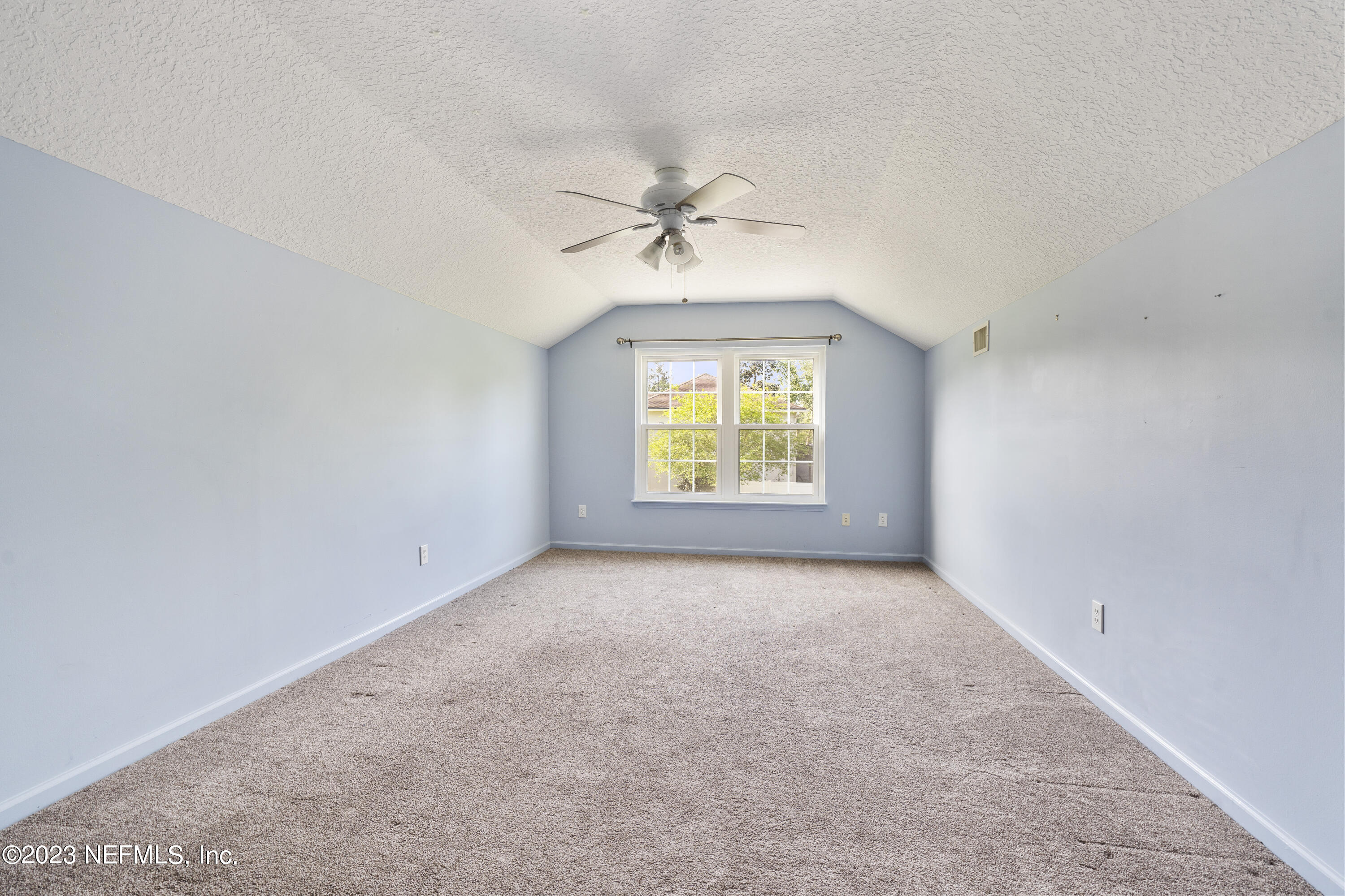 312 West Tropical Trace St. Johns, FL 32259 - Photo 32 of 57 an empty room with windows and ceiling fan