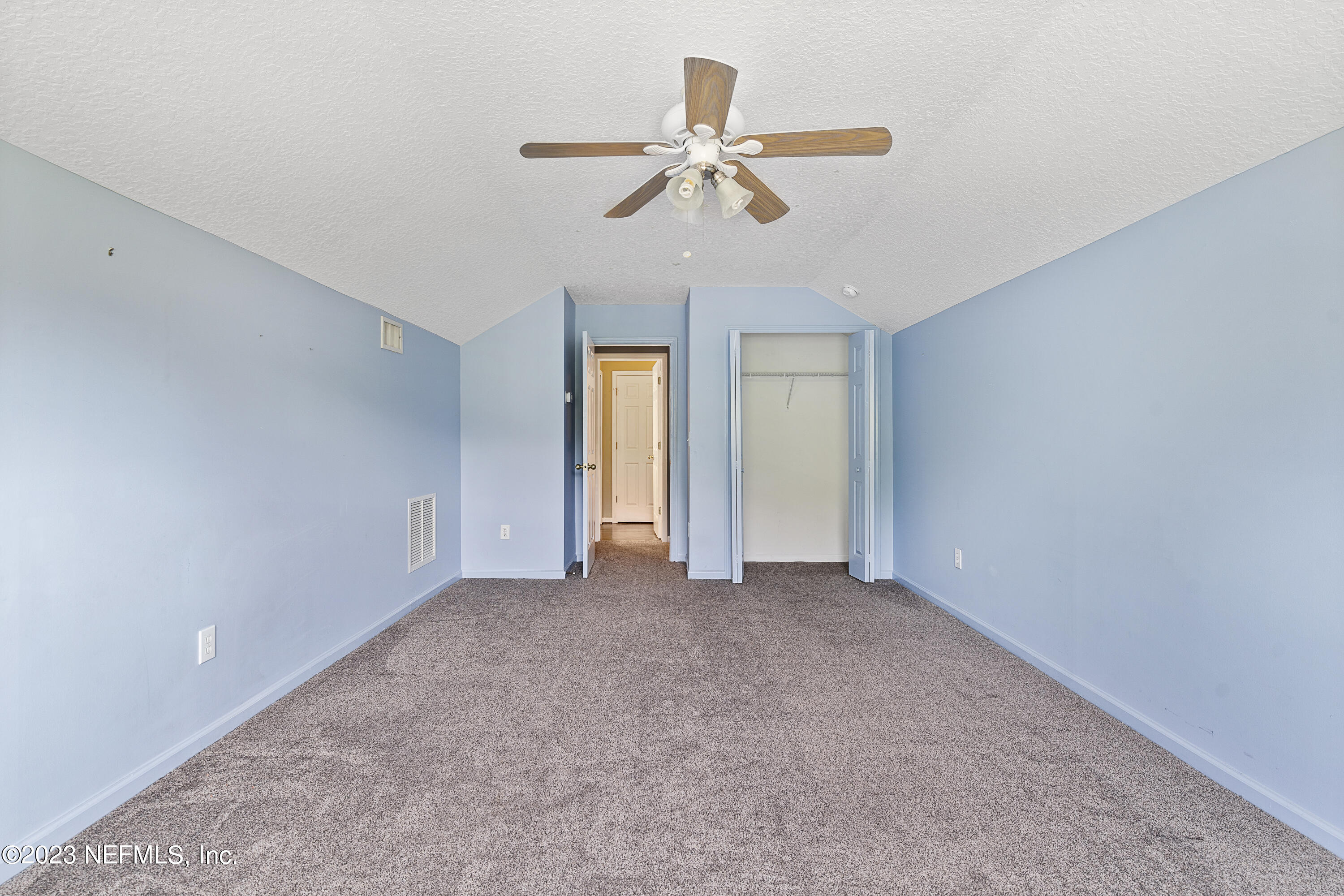 312 West Tropical Trace St. Johns, FL 32259 - Photo 33 of 57 a view of an empty room with a ceiling fan