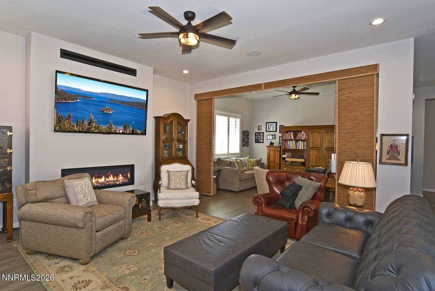 2332 Hammer Falls Drive Reno, NV 89521 - Photo 10 of 57 a living room with furniture and a flat screen tv
