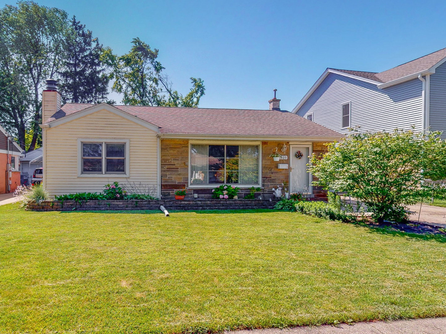 1305 Wayne Drive Des Plaines, IL 60018 - Photo 1 of 25 a view of a house with swimming pool and a yard