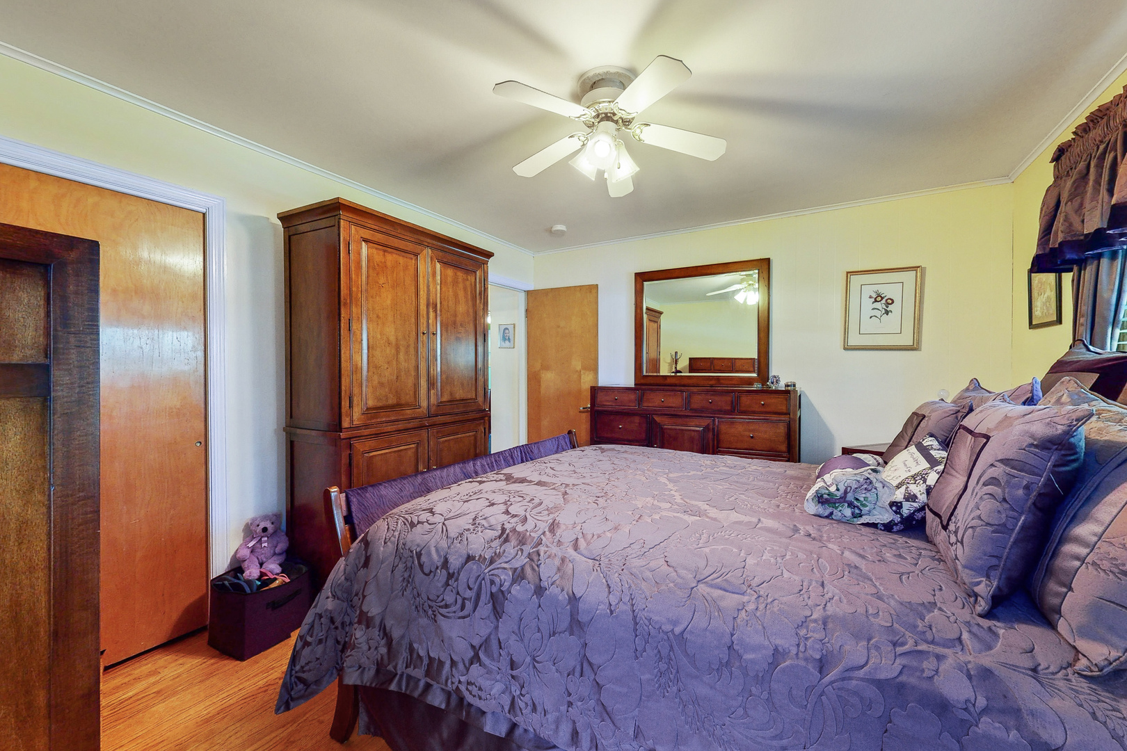 1305 Wayne Drive Des Plaines, IL 60018 - Photo 11 of 25 a bedroom with a bed and a chandelier