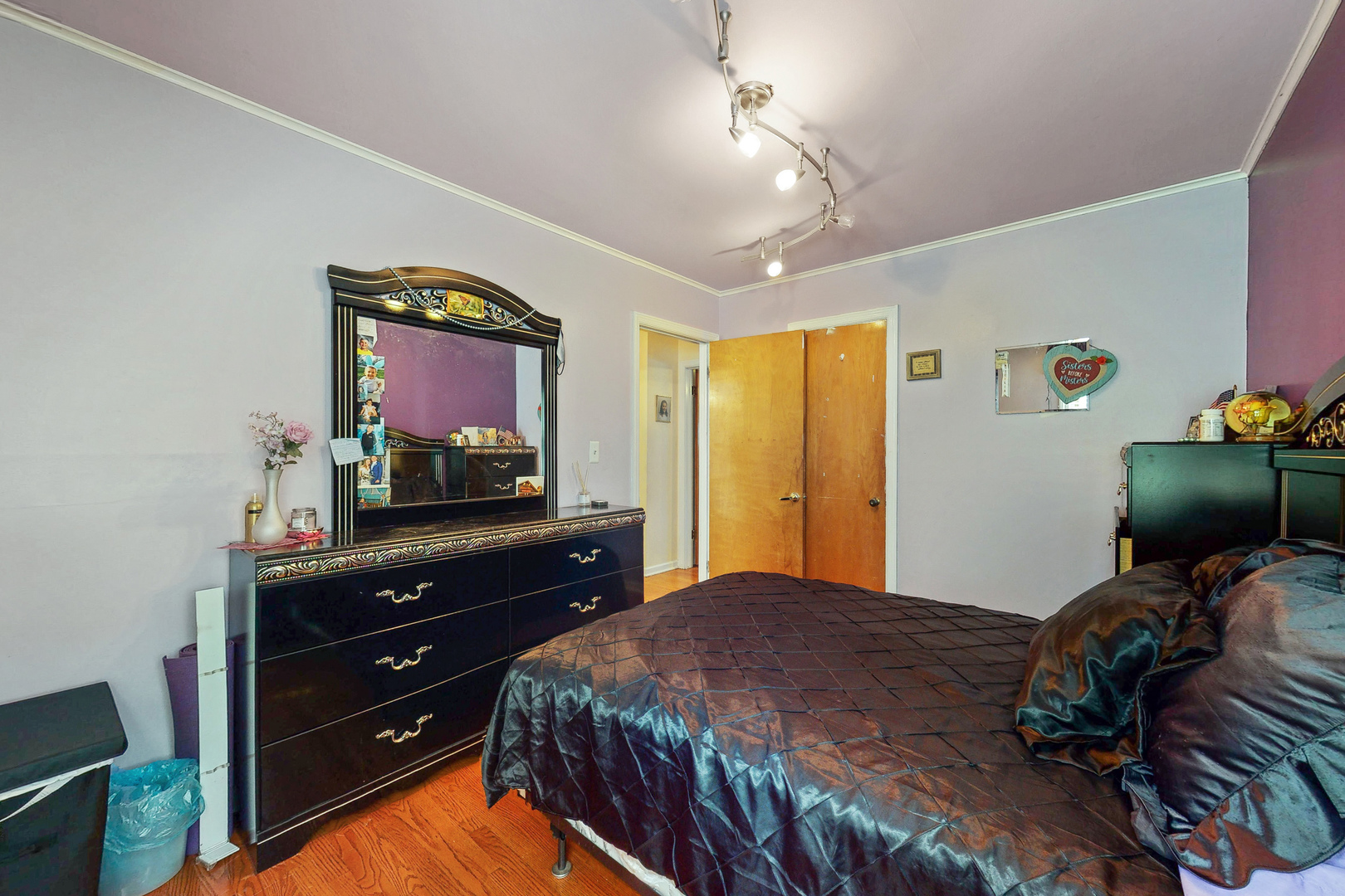 1305 Wayne Drive Des Plaines, IL 60018 - Photo 14 of 25 a bedroom with a bed and a flat tv screen on dresser