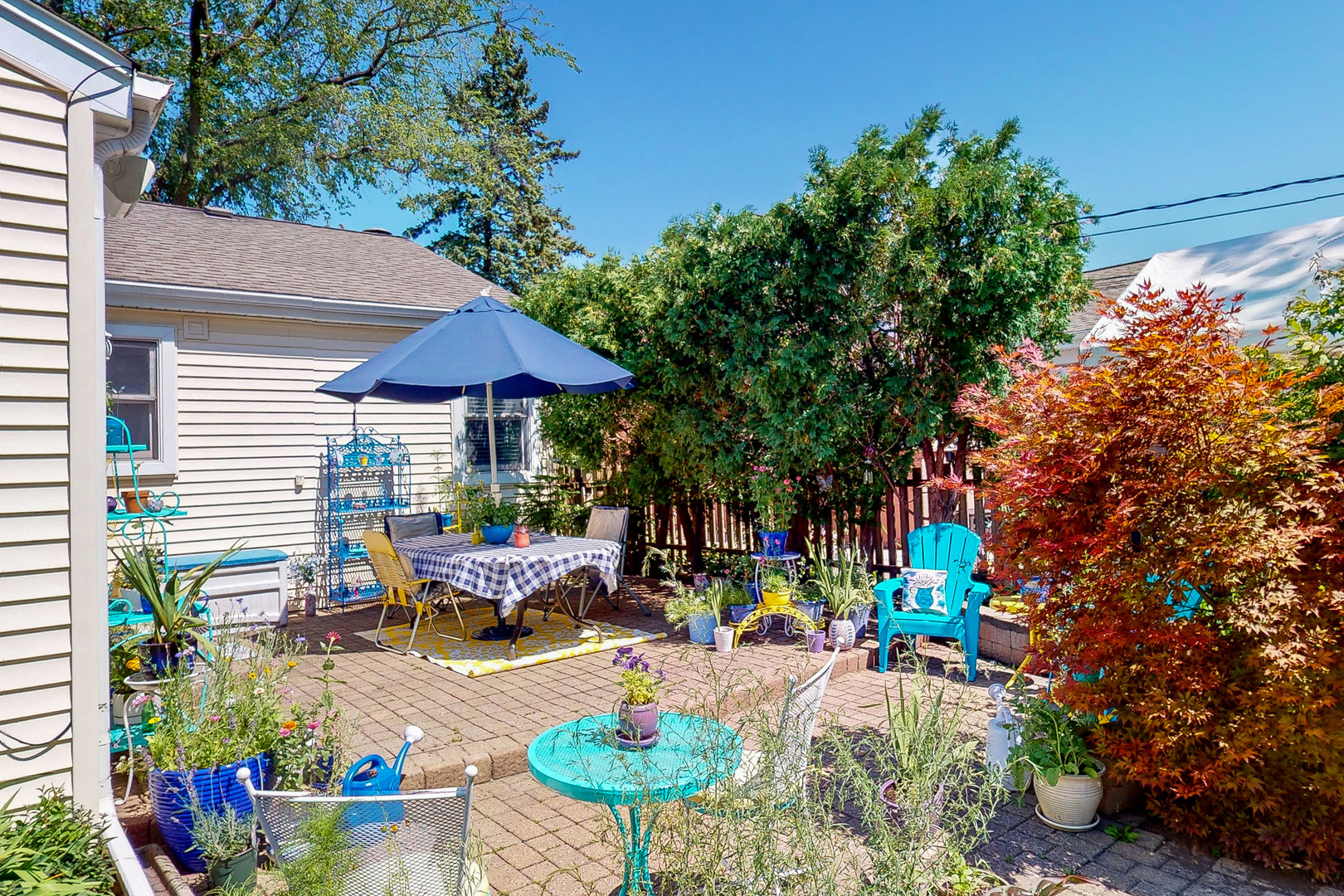 1305 Wayne Drive Des Plaines, IL 60018 - Photo 21 of 25 a view of a chairs and table in a backyard