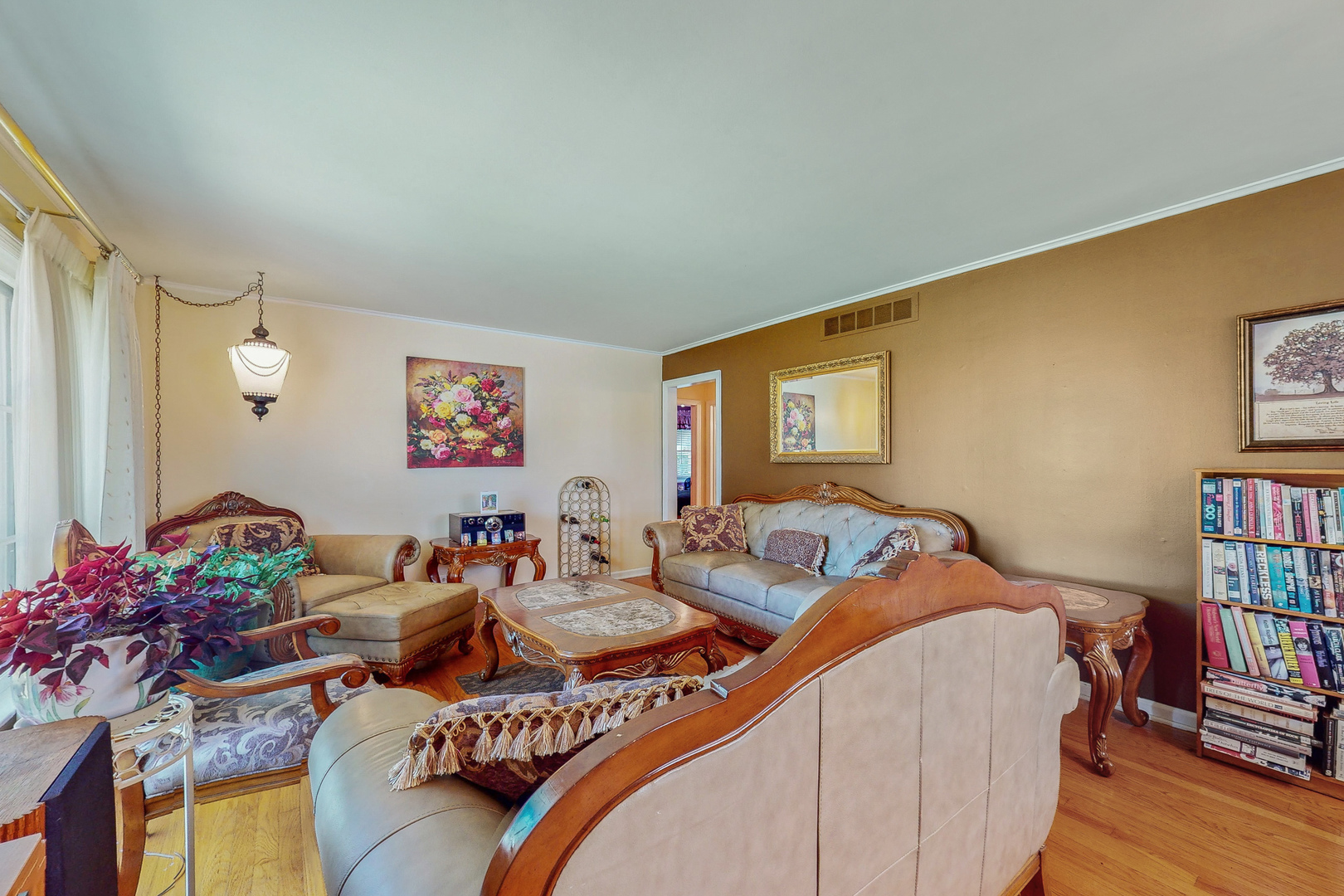 1305 Wayne Drive Des Plaines, IL 60018 - Photo 3 of 25 a living room with furniture and a book shelf