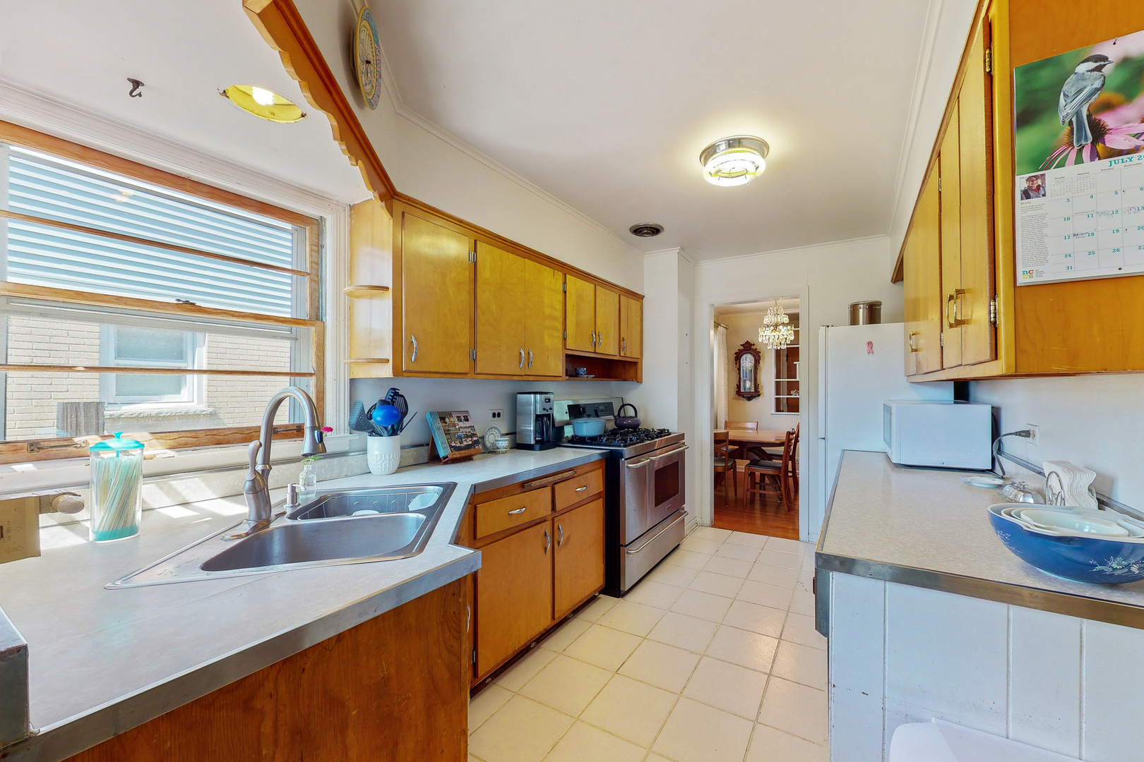 1305 Wayne Drive Des Plaines, IL 60018 - Photo 5 of 25 a kitchen with stainless steel appliances kitchen island granite countertop a sink and cabinets