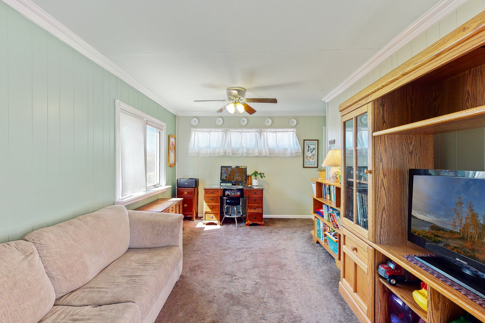 1305 Wayne Drive Des Plaines, IL 60018 - Photo 8 of 25 a living room with furniture and a flat screen tv