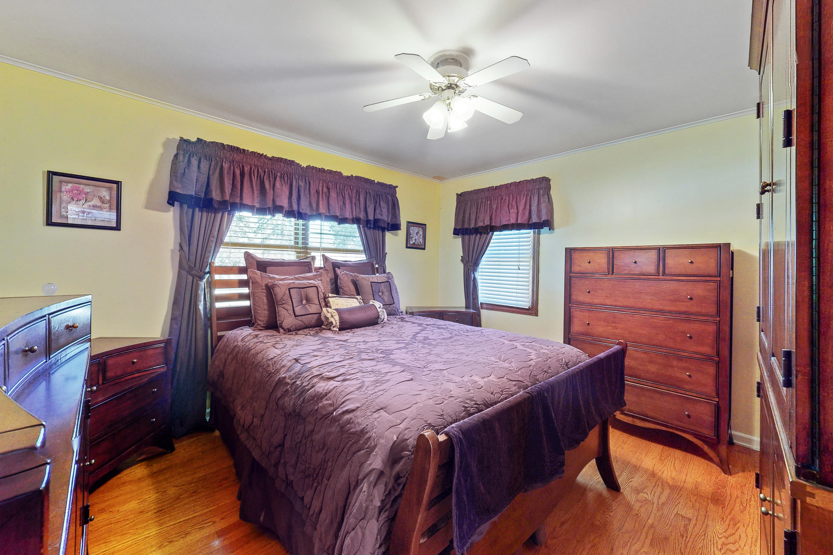 1305 Wayne Drive Des Plaines, IL 60018 - Photo 9 of 25 a bedroom with a large bed and a chandelier