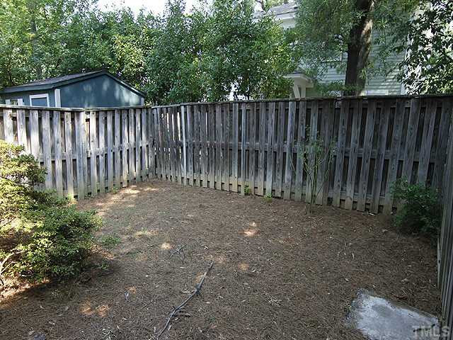 816 Berkeley Street, Unit B Durham, NC 27705 - Photo 12 of 12 a garden view with wooden fence