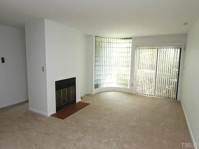 816 Berkeley Street, Unit B Durham, NC 27705 - Photo 3 of 12 a view of a livingroom with a fireplace