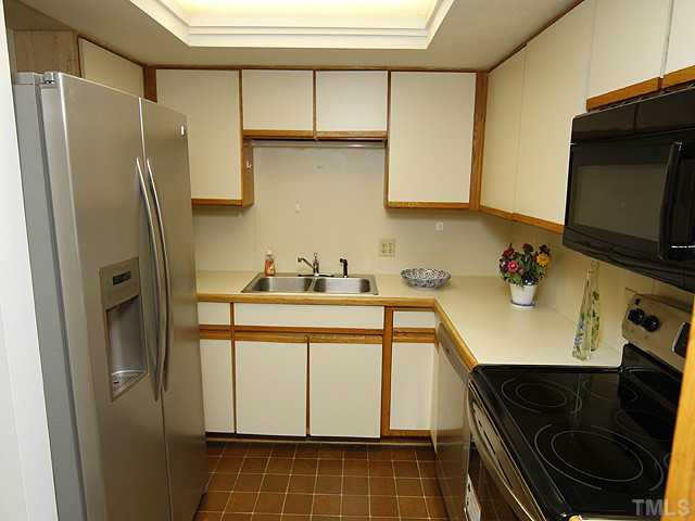 816 Berkeley Street, Unit B Durham, NC 27705 - Photo 5 of 12 a bathroom with a sink a toilet and shower
