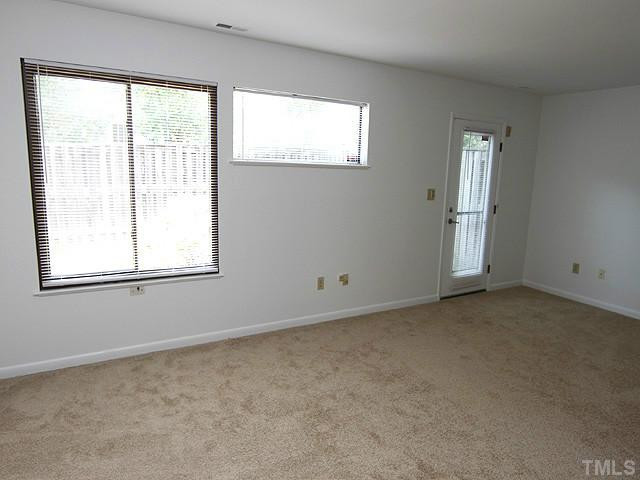 816 Berkeley Street, Unit B Durham, NC 27705 - Photo 6 of 12 an empty room with windows